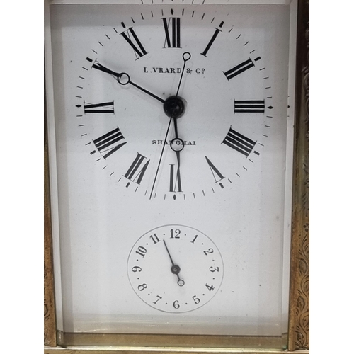 348 - **WITHDRAWN**A brass cased repeater Carriage Clock, the rectangular enamel dial inscribed L. Vrard &... 