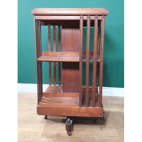 409 - An Edwardian walnut revolving Bookcase 2ft 10in H x 1ft 6in W and a walnut veneered Bedside Cupboard... 