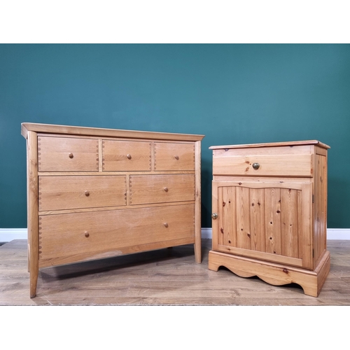 413 - A modern oak Chest of seven drawers 3ft 7in W x 2ft 10in H and a pine single door Cupboard fitted fr... 