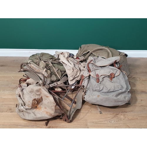 421 - Five assorted canvas Rucksacks with metal frameworks, etc. (R3).