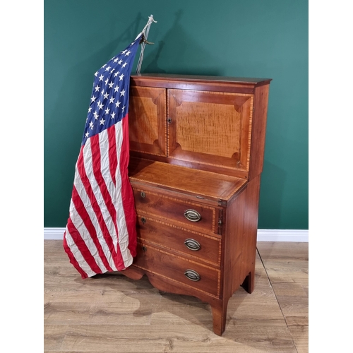 423 - A walnut and satinwood Desk Cabinet fitted pair of cupboard doors enclosing drawers and pigeonholes ... 