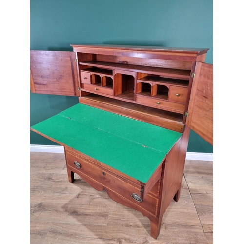 423 - A walnut and satinwood Desk Cabinet fitted pair of cupboard doors enclosing drawers and pigeonholes ... 