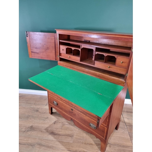 423 - A walnut and satinwood Desk Cabinet fitted pair of cupboard doors enclosing drawers and pigeonholes ... 