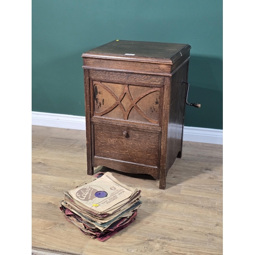 433 - An oak cased H.M.V. Gramophone  and a collection of Records 2ft 3in H x 1ft 5in W (R3)