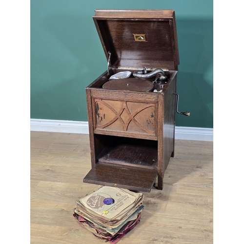 433 - An oak cased H.M.V. Gramophone  and a collection of Records 2ft 3in H x 1ft 5in W (R3)