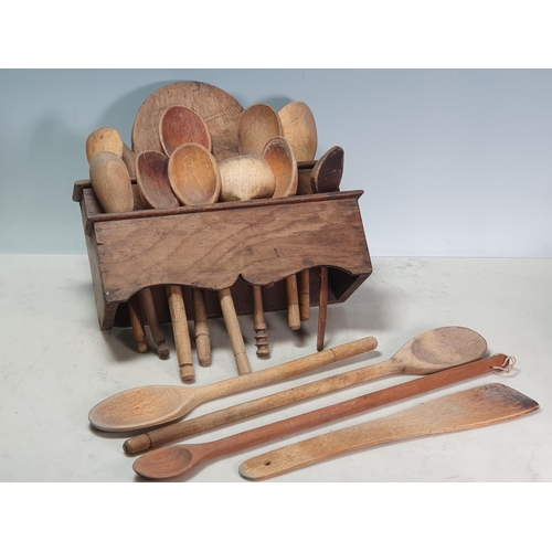 44 - An antique oak Spoon Rack containing a collection of Wooden Spoons (R2)