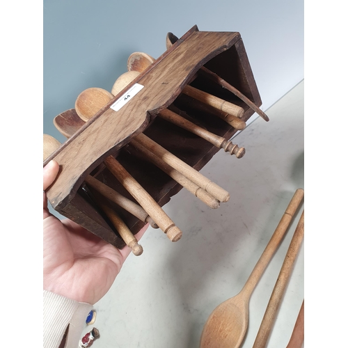 44 - An antique oak Spoon Rack containing a collection of Wooden Spoons (R2)