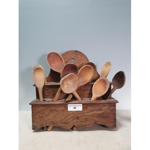 44 - An antique oak Spoon Rack containing a collection of Wooden Spoons (R2)