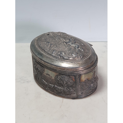 441 - A white metal oval Box with embossed bucolic scenes 6in W A/F (R3)