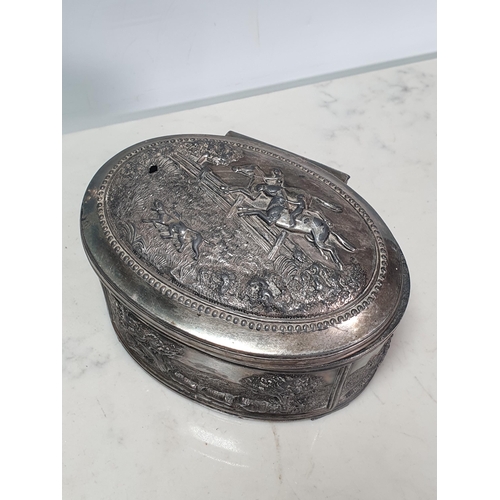 441 - A white metal oval Box with embossed bucolic scenes 6in W A/F (R3)