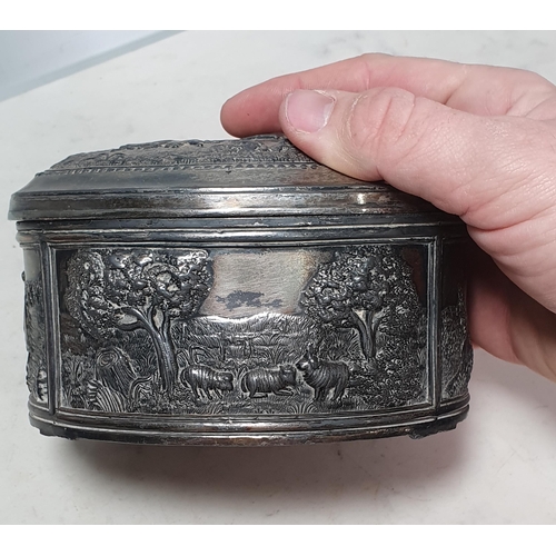 441 - A white metal oval Box with embossed bucolic scenes 6in W A/F (R3)