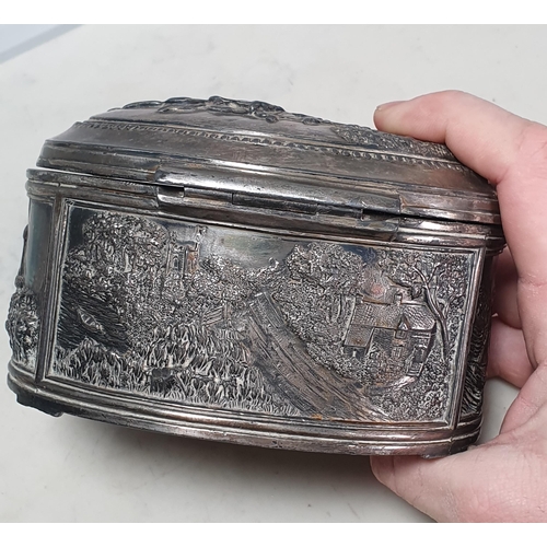 441 - A white metal oval Box with embossed bucolic scenes 6in W A/F (R3)