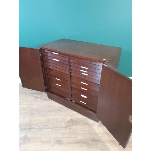 444 - A stained wood Collector's Cabinet having a pair of cupboard doors enclosing multiple drawers, 2ft 8... 