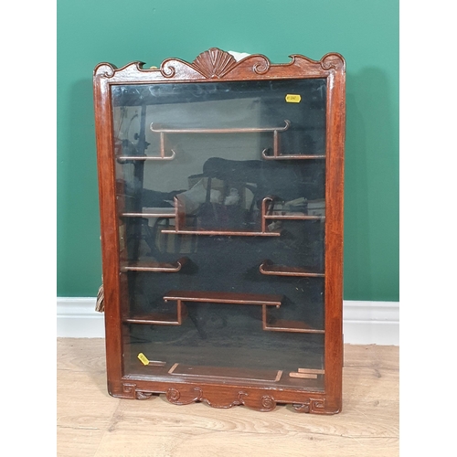 456 - A Chinese style hardwood wall mounted Display Case with single glazed door enclosing shaped shelves,... 