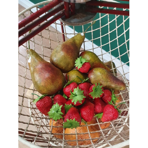 480 - A three-tier fruit and vegetable Stand containing a selection of simulated fruit and bread, (R6)