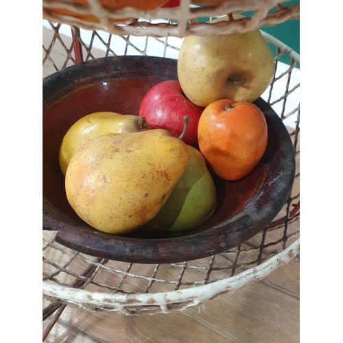 480 - A three-tier fruit and vegetable Stand containing a selection of simulated fruit and bread, (R6)