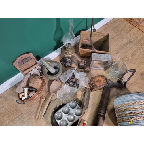 499 - A wooden and metal Cobbler's Last, a brass and iron Paraffin Lamp, a Biscuit Tin, a Pestle and Morta... 