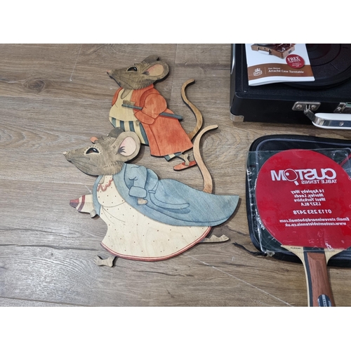 514 - A Record Player, a Table Tennis Bat and two wooden cut out Mice (R3)