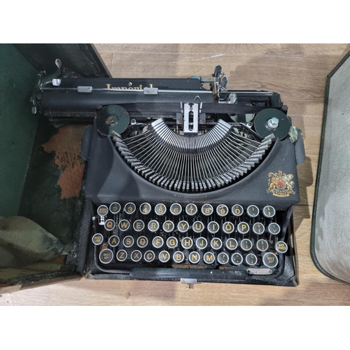 516 - A cast iron black painted Sewing Machine, an electric Sewing Machine and a cased Typewriter, (R6)