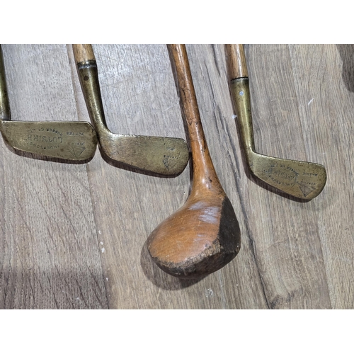 520 - Four old children's Golf Clubs, two engraved 'LOTSIRB,' Anderson's Rubber Company Ltd, with two ball... 