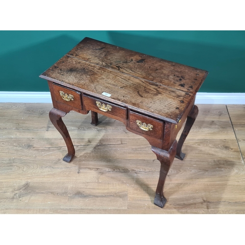 531 - An antique oak Lowboy with moulded top above three drawers raised in square cut cabriole supports 2f... 