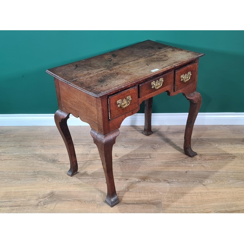 531 - An antique oak Lowboy with moulded top above three drawers raised in square cut cabriole supports 2f... 