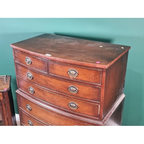 534 - A reproduction bowfronted Chest of two short and five long drawers on splay bracket feet, 4ft 3in H ... 