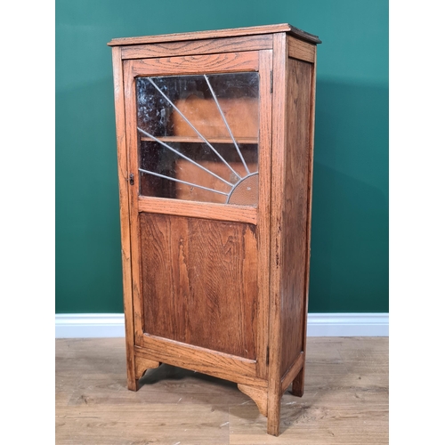 538 - An oak Cabinet with sunburst leaded glazed panel door, 3ft 8in H x 1ft 11in W x 10in D, (R6)