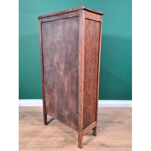 538 - An oak Cabinet with sunburst leaded glazed panel door, 3ft 8in H x 1ft 11in W x 10in D, (R6)