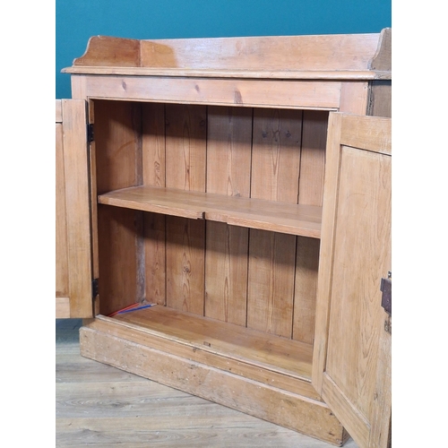 539 - A pine Cupboard with low raised back with a pair of panelled doors on plinth base, 3ft 3in H x 3ft 1... 