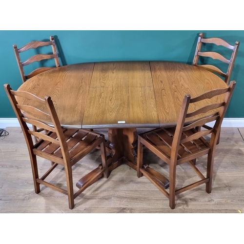 548 - An elm extending Dining Table thought to be Ercol and a set of four Ercol ladderback Dining Chairs, ... 