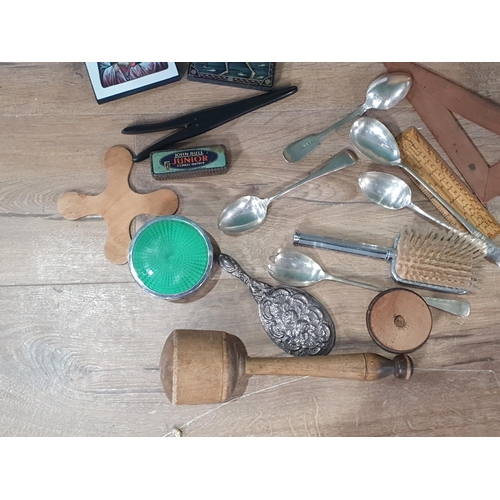 570 - A small box of collectables to include treen glove stretchers, a masher, dressing table items, etc; ... 