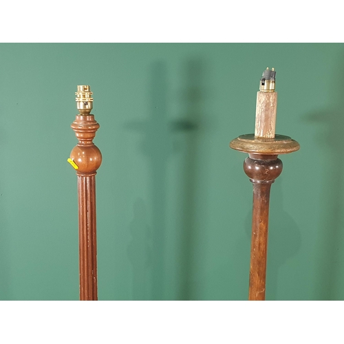 584 - Two wooden Standard Lamps, failed PAT, (R7)