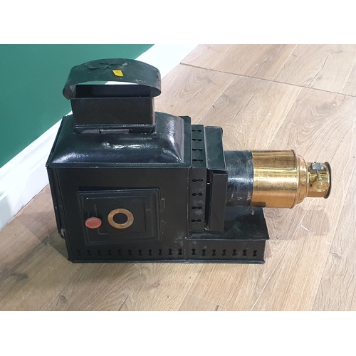 596 - A black painted and brass Magic Lantern in case, (R8)