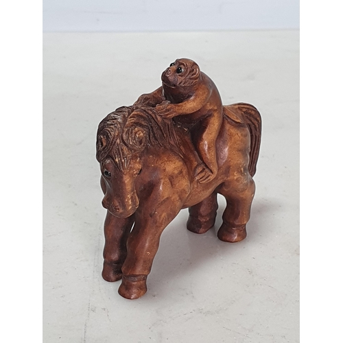 6 - Two carved wood Netsuke one in the form of a Monkey sat on a Horse, the other in the form of a Horse... 