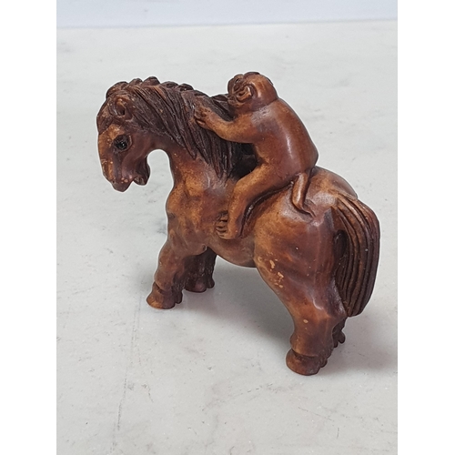 6 - Two carved wood Netsuke one in the form of a Monkey sat on a Horse, the other in the form of a Horse... 