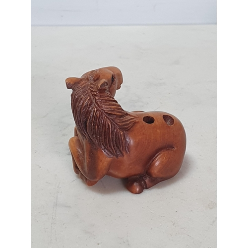 6 - Two carved wood Netsuke one in the form of a Monkey sat on a Horse, the other in the form of a Horse... 