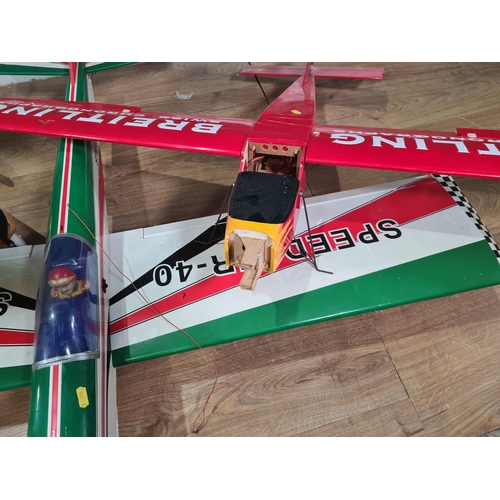 627 - Two petrol driven radio controlled single wing Aircraft complete with servos, an electric Trainer Ai... 