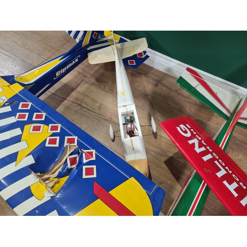 627 - Two petrol driven radio controlled single wing Aircraft complete with servos, an electric Trainer Ai... 