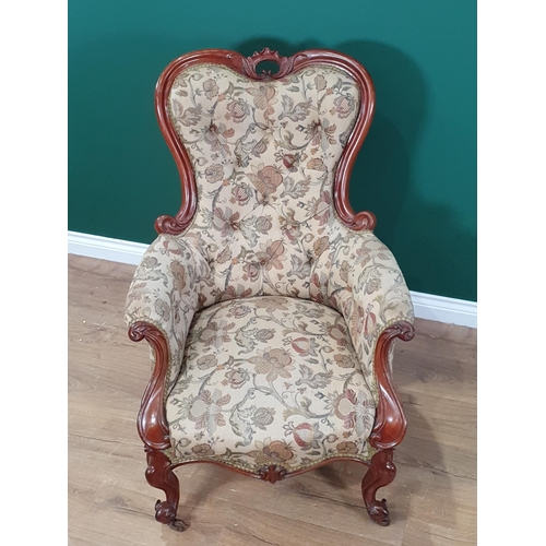 653 - A Victorian walnut framed Armchair on cabriole supports 3ft 4in H x 2ft 4in W (R9)