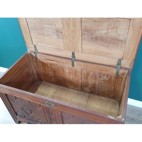 662 - A carved oak two panel Coffer with sunken lid dated 1913 4ft 1in W x 2ft 6in H (R8)