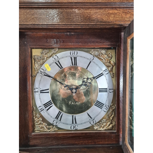 679 - An oak cased Long case Clock, with square brass Dial, silvered chapter ring, bearing makers name 