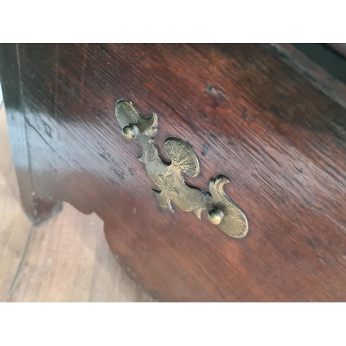 7 - An 18th Century oak Box Stool with hinged lid, shaped frieze, engraved brass escutcheon, 19in wide