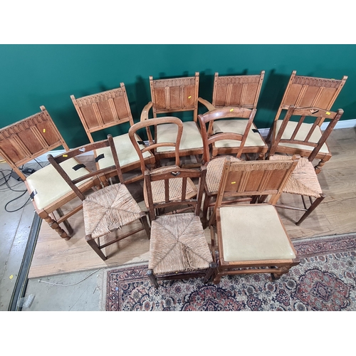 713 - A set of Six oak Framed Dining Chairs with arched top rails, with cream upholstered drop in seats an... 