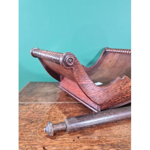 78 - A 19th Century oak Cheese Coaster with shaped frieze, 16 x 10in, and an oak Rolling Pin, 21in (R2)