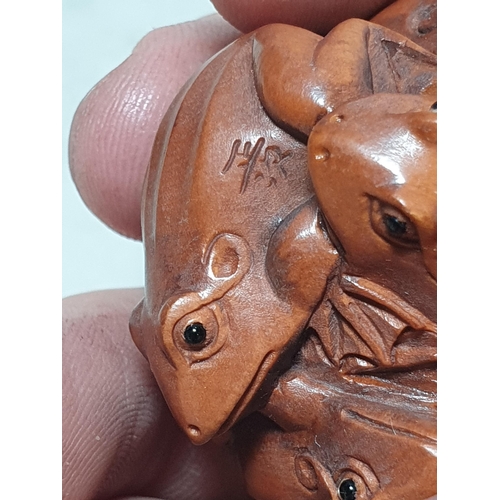 8 - Two carved wood Netsuke in the form of a cluster of Frogs, the other in the form of a Mouse. (Cab).