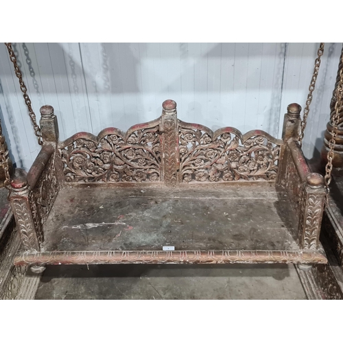 9 - A carved Indian hardwood Swing Seat, with A frame canopy with carved rosette panel decoration, raise... 