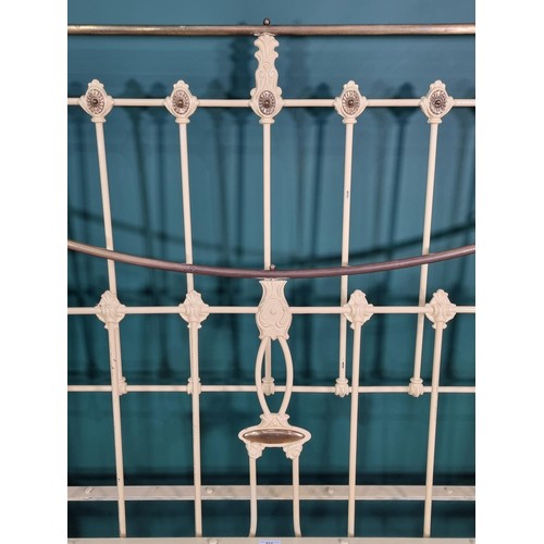 613 - A brass and iron Bed frame painted cream with stylised leafage designs. (R1)