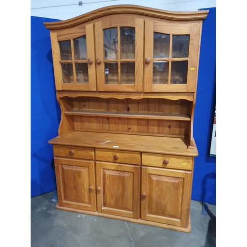 721 - A modern pine Sideboard/Dresser the top section with pair of glazed doors enclosing shelves, above o... 