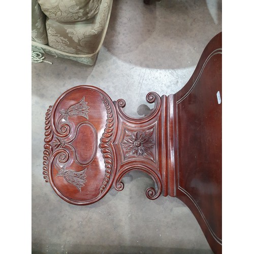 546 - A pair of Victorian mahogany Hall Chairs with carved backs and an Edwardian Elbow Chair with satinwo... 